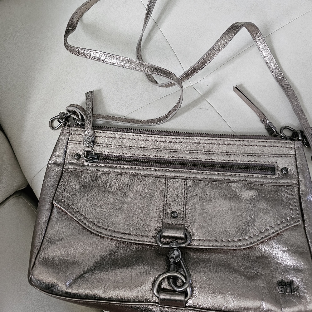 Crossbows gold The Sak purse with pockets and zip sections